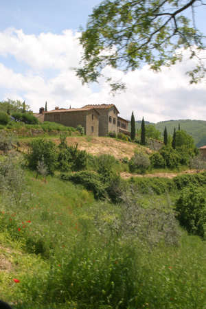 A villa overlooking the Tuscan hills in Italyの写真素材
