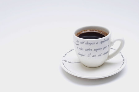A white cup of black coffee