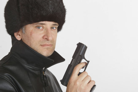 A gun toting, scarred Eastern european gangster/spy