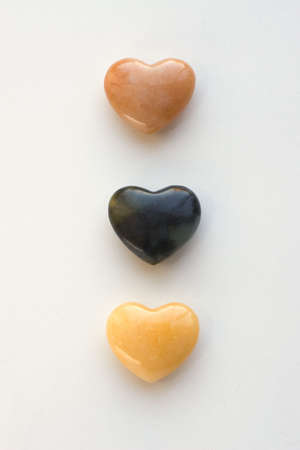 Three agate hearts shot on a white backgroundの写真素材
