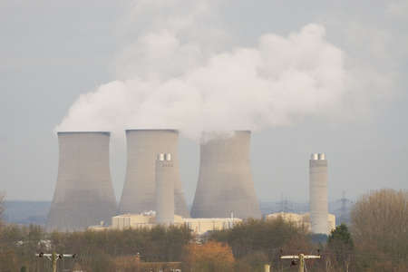 A power station pumping water vapour pollution into the atmosphereの写真素材