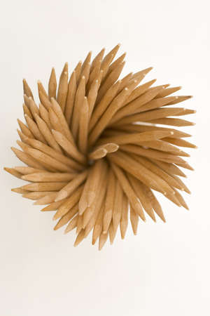 A pot of cocktail sticks shot from overhead.の写真素材