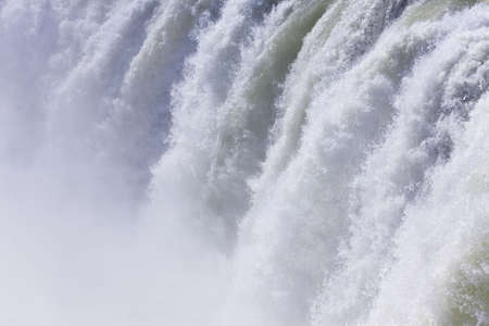 Full frame shot of water cascading over a huge waterfall. Shot on location at Godafoss in Iceland.の写真素材