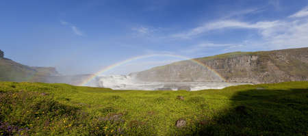 Panoramic Photograph showing a double rainbow spanning Gullfoss waterfall on the Hvita River in southwest Icelandの写真素材