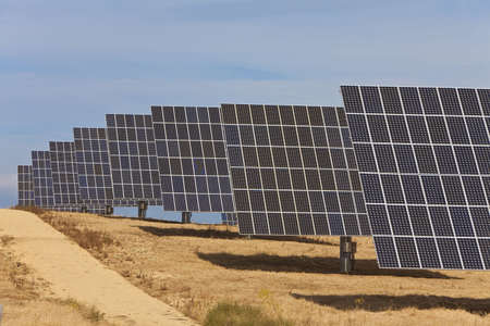 A field of photovoltaic solar panels providing alternative green energyの写真素材