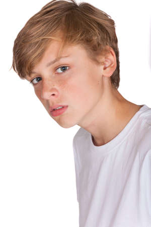 Studio Cut Out Portrait of Teenage Boy Child in White T-shirtの写真素材
