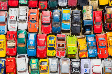 Overhead photograph of old toy carsの写真素材