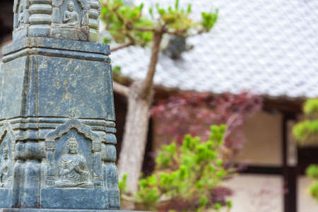 Carving of Buddha on a statue at an Asian Buddhist Templeの写真素材