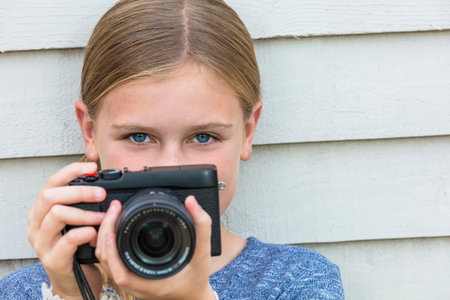 Girl child taking picture with a camera