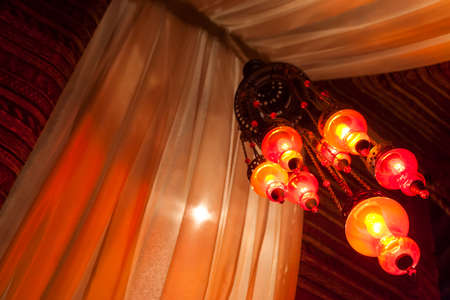 Traditional Arab lamps inside an Arabic tentの写真素材