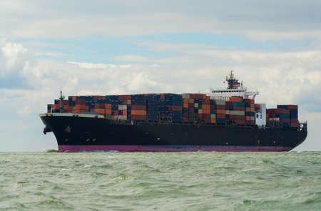 Container cargo transport ship sailing at seaの写真素材