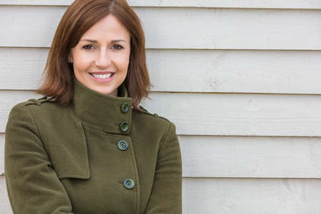 Portrait shot of an attractive, successful and happy middle aged woman female outside smilingの写真素材