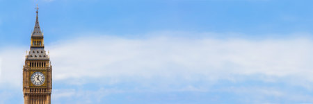 Panoramic web banner image clock face on the famous landmark clock tower known as Big Ben in London,...