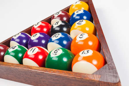 Close up of pool balls in a triangle on a whhite backgroundの写真素材