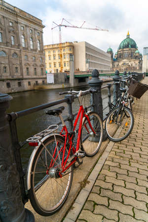 Bicycles by the River Spree near Berlin Cathedral, the Berliner Dom, Berlin, Germanyの写真素材
