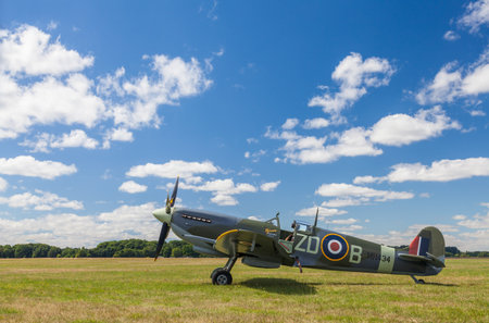 SUPERMARINE SPITFIRE MARK IXB, MH434, ENGLAND â AUGUST 11 2013, Supermarine Spitfire Mark IXb World War Two fighter plane, parked by the grass runway at White Waltham Airfield, Maidenhead, Englandのeditorial素材