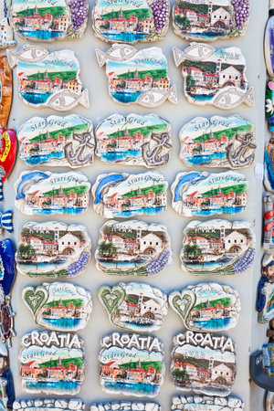 CROATIAN TOURIST FRIDGE MAGNETS, CROATIA â AUGUST 17 2013, Tourist resort souvenir fridge magnets for sale in Stari Grad, Croatia, Europeのeditorial素材