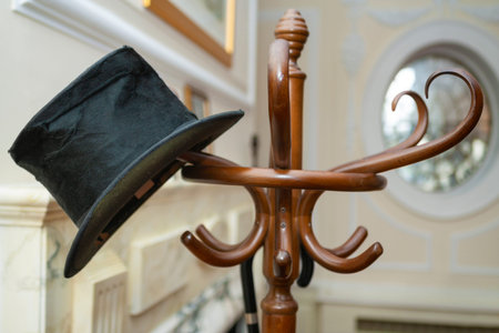 Party Invitation Concept Top Hat and Umbrella on a Coat Standの写真素材