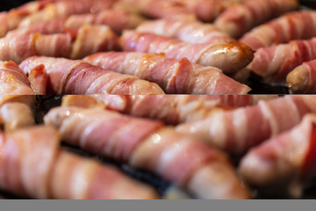 Macro close up of sausages wrapped bacon or Pigs in Blankets cookingの写真素材