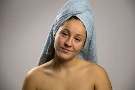 Girl after shower with a towel and happy.の写真素材