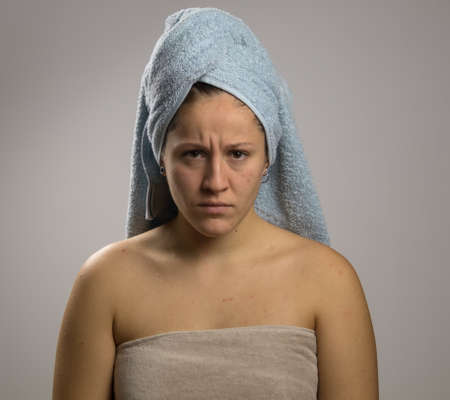 Angry girl after shower with two towelsの写真素材