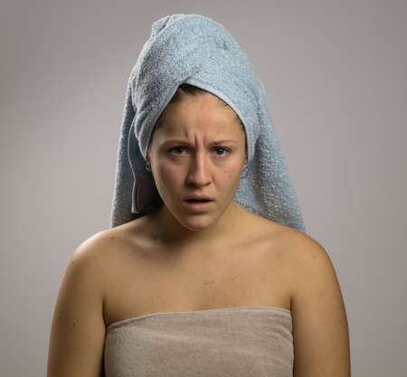 pissed off girl after shower with two towelsの写真素材