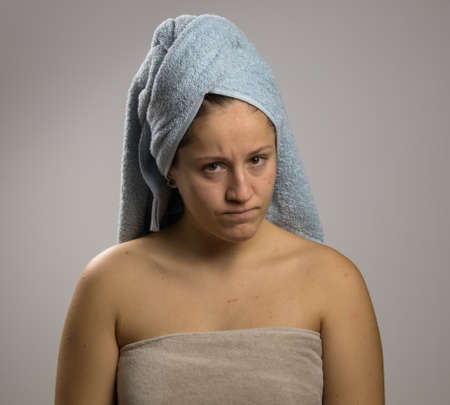 pissed off girl after shower with two towelsの写真素材
