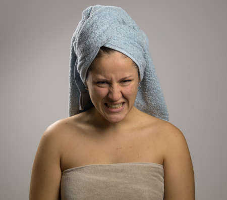 Angry girl after shower with two towelsの写真素材