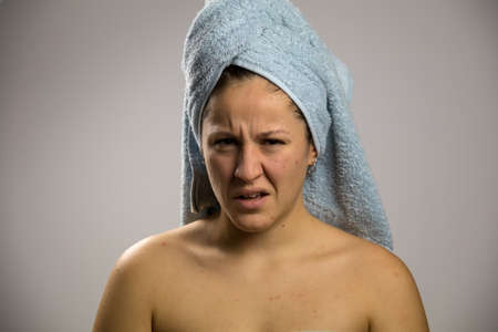 Angry girl after shower with two towelsの写真素材