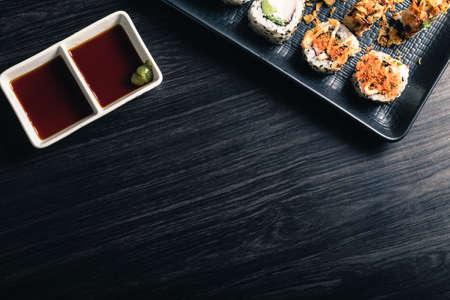 Sushi rolls with soy sauce on dark background. Space textの写真素材