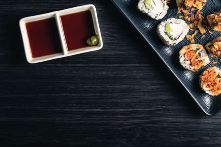 Sushi rolls with soy sauce on dark background. Space textの写真素材