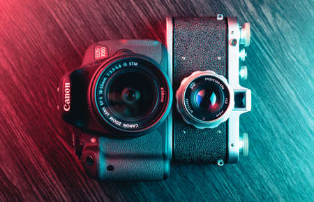 Granada, Spain, January 6, 2019: Old and new camera. Modern Canon EOS 700D and old camera Zenitのeditorial素材
