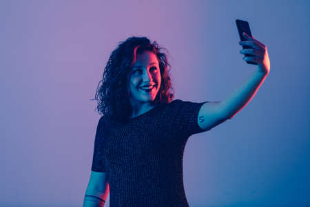 young girl making selfie and smilingの写真素材