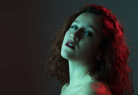 young woman's cheek and face with typical problem with acne, acne rosacea, and pimples in the adulthood timeの写真素材