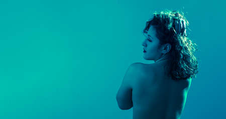 Emotional portrait, a nude girl in various emotional poses. Like under water. Studio shot. Copyspaceの写真素材
