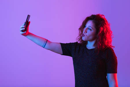 young girl making selfie and having funの写真素材