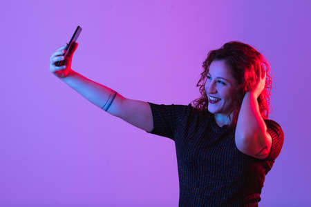 young girl making selfie and having funの写真素材
