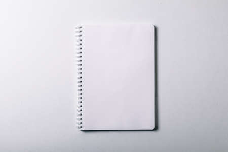opened notebook. Vertical blank copybook with metallic silver spiral. mock up of organizer or diary isolatedの写真素材
