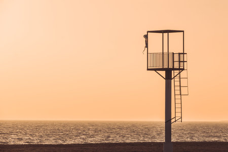 Almerimar beach lifeguard tower at sunset. Deserted beach, no people. Almeria, Andalusia, Spainの写真素材