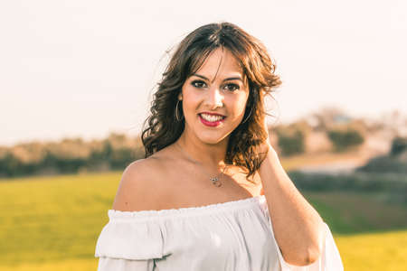 Pretty young woman on nature background - close up face portraitの写真素材