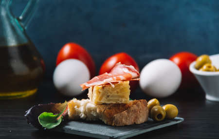 some spanish tapas, such as tortilla de patatas, serrano ham and olivesの写真素材