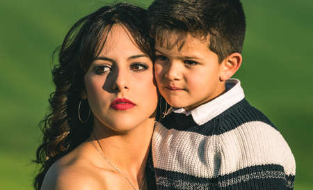 Young mother and little boy in the meadow.の写真素材