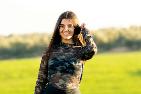 Pretty young woman on nature backgroundの写真素材