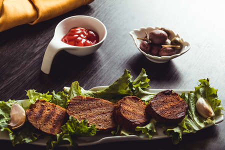 Cooking vegan food. Seitan is vegan meat for veggie burgerの写真素材