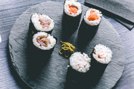 Sushi on wood table. Elegant japanese restaurant. Retro styleの写真素材