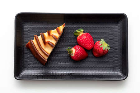 Homemade cheese cake and strawberry on plate. White backgroundの写真素材