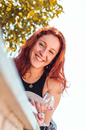 Happy redhead girl in a park, Close up shotの写真素材