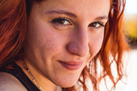 Happy redhead girl in a park, Close up shotの写真素材