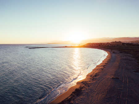 Girl and dog at the beach at sunset, Aerial Viewsの写真素材