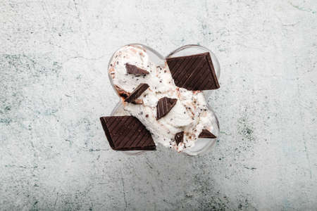 Speciality Italian stracciatella ice cream scoop with flakes of dark chocolate in a creamy vanilla ice-cream. Top view. Speciality Italian stracciatella iceの写真素材